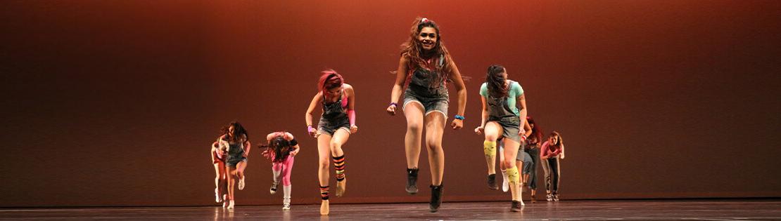 A Pima dance group on stage